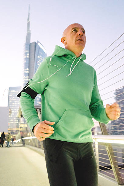 istock Mature Man Running Outdoors Wearing Sport Clothes 545087570