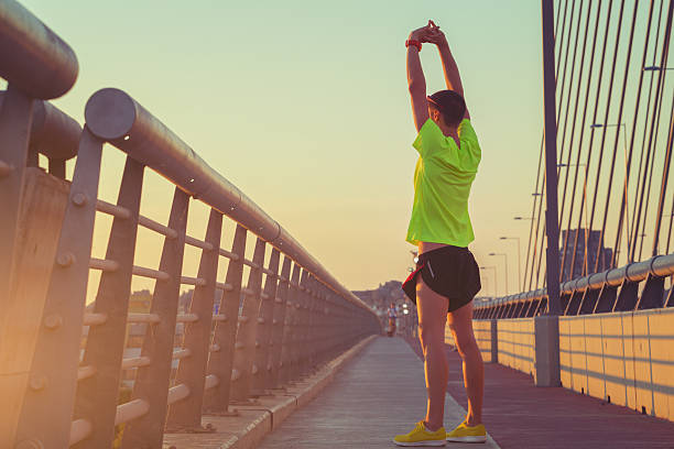 istock Urban Jogger Stretching on Bridge 545088140