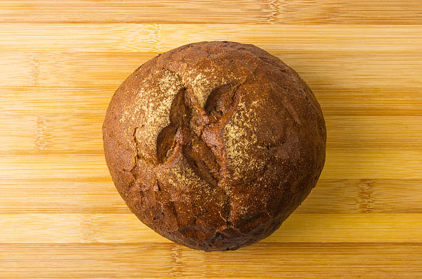 istock dark bread on wood board 545088424
