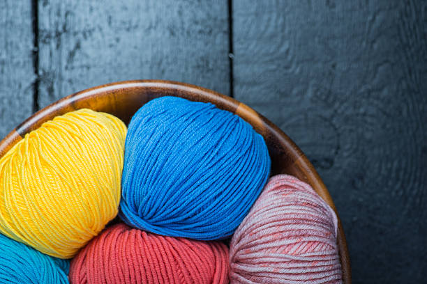 istock Colorful knitting yarn balls in basket 545088514