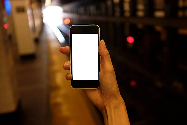 istock woman using a smartphone on the metro subway station 545088704