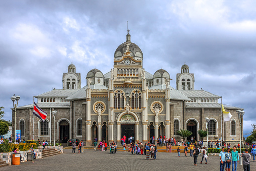Cartago, Costa Rica - January 25, 2015: Basilica de Nuestra Senora de los Angeles in Cartago, Costa Rica under a dramatic sky. The Basilica is the most important pilgrimage site in the country, while Cartago is the religious capital of Costa Rica.