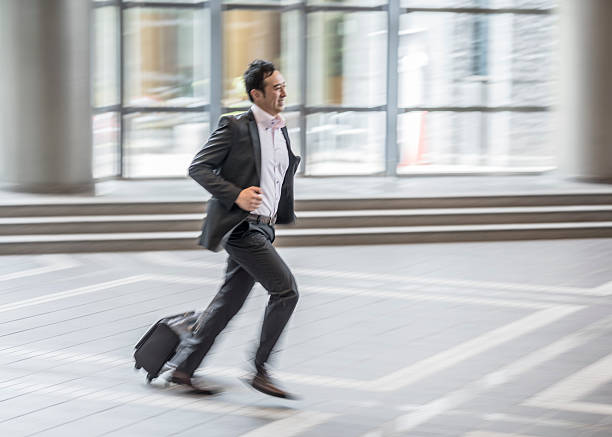 istock Businessman late for work running 545089740