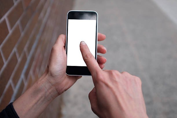istock Woman's hand holding smart phone 545091064
