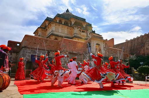 Kumbhalgarh, India - January 28, 2014: Indian men in traditional costumes dance at the open festival of traditional Rajasthan culture.