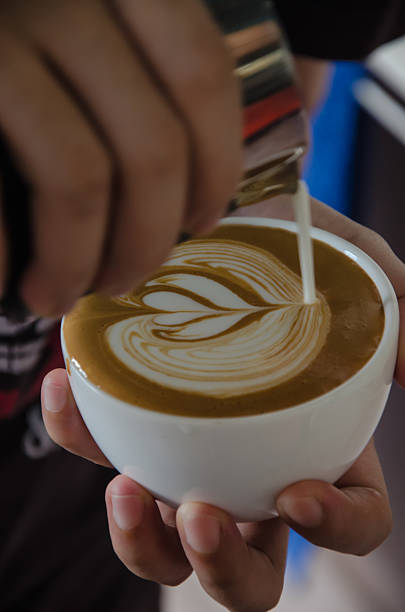 istock Barista making a cup of coffee soft focus image . 545091310