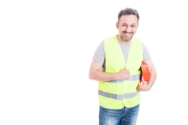 istock Cheerful male constructor holding his protection helmet 545091382