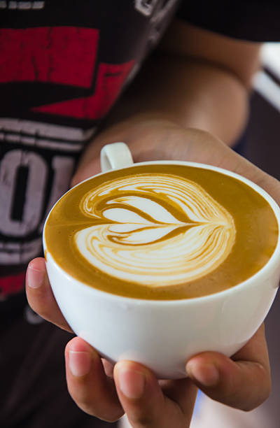 istock Barista making a cup of coffee soft focus image . 545091390