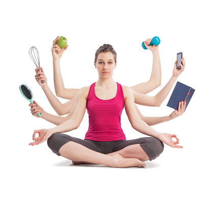retrato de mujer multitarea en posición de yoga con muchos brazos photo