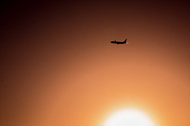 istock Airplane flying at sunset in Mallorca, Spain 545091816