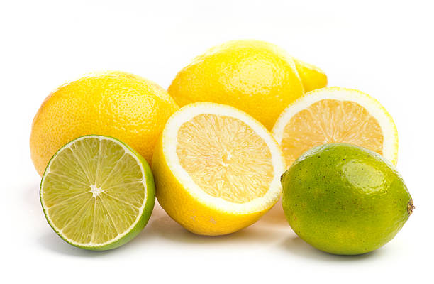 istock Whole and sliced fresh limes and lemons on on white 545093020
