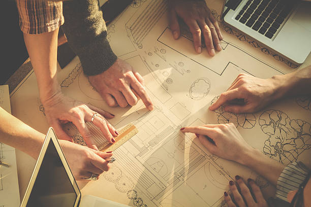 istock Young group of people/architects discussing business plans 545093134
