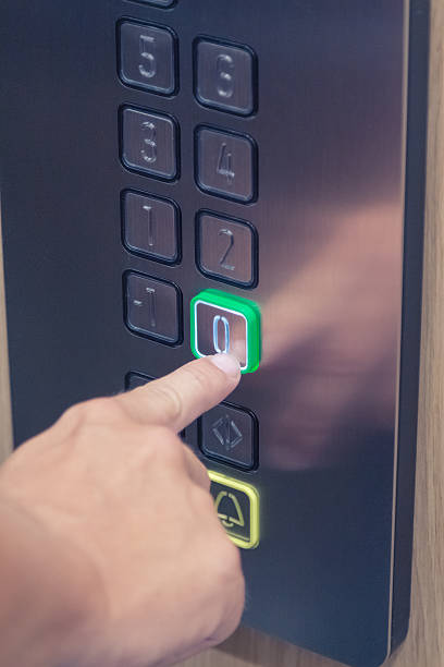 istock Male finger pressing the zero floor button in the elevator 545093246