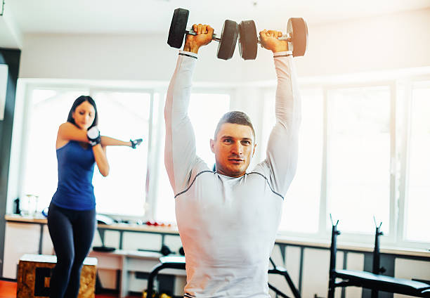 istock Two athletes warm up and exercise in gym 545093556