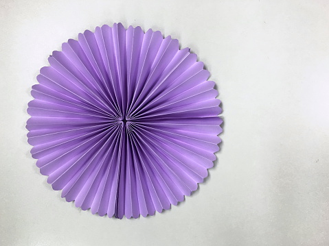 Purple Circle shape folding paper on gray background