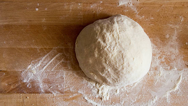 dough on wooden cooking board - dough sphere kneading bread imagens e fotografias de stock