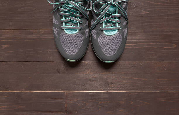 istock Sneakers is on the wooden background 545093992