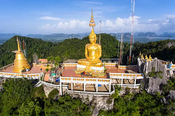 Tiger Cave or Wat Thum Sua temple is a major tourist destination.  At the top of the mountain there is a large golden Buddha statue which is a popular tourist attraction.