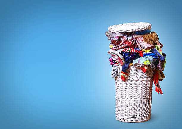 Wash White straw basket full of dirty Laundry laundry stock pictures, royalty-free photos & images