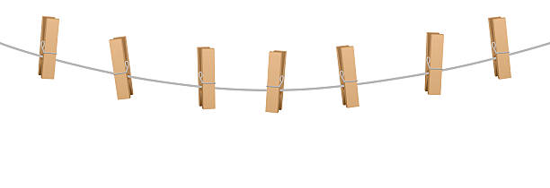Clothes Pins Clothes Line Rope Seven Wooden Pegs Clothes pins on a clothes line rope holding nothing. clothespin stock illustrations