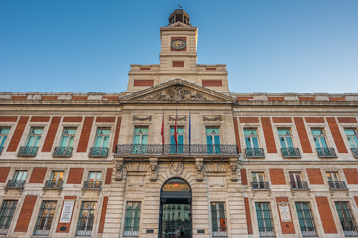 The Old Post Office (1766-68) building, Used as ministry of the interior during Franco's dictatorship.  It is currently the seat of the Presidency of the Madrid Community. Located in the Puerta del Sol, one of the busiest in Madrid. Originally one of the gates in the old city wall in the 15th century.