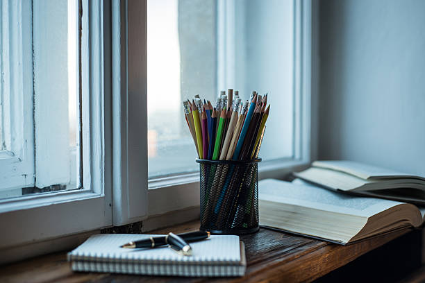 istock Spiral notebook with black ball pen and pencils 545102322