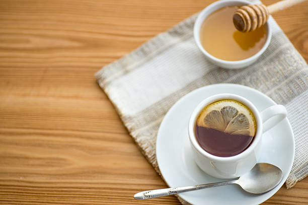 istock Herbal tea in a cup with  and honey dipper 545103468