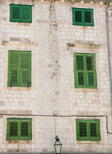 Building with green window shutters in Dubrovnik Croatia