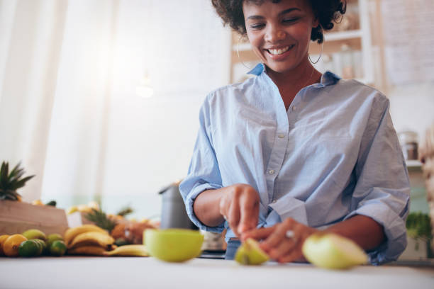 istock African woman preparing fresh fruit juice 545104938