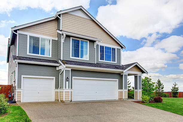 istock Large two story house with siding, two garage spaces 545105398