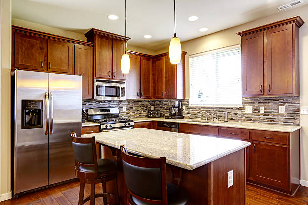 istock Kitchen mahogany storage combination with steel appliances 545110356