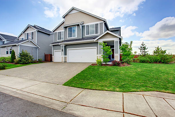 istock Large two story house with siding, two garage spaces 545110542