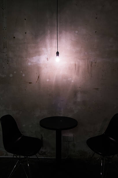 istock Shot of glowing light bulb in front of empty blackboard 545111862