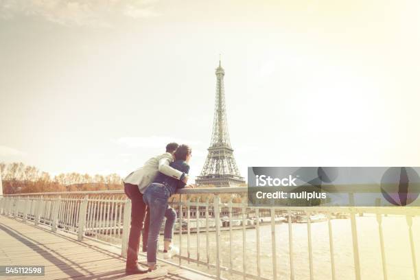 Multiethnic Couple Having Fun In Paris Near Eiffel Tower Stock Photo - Download Image Now