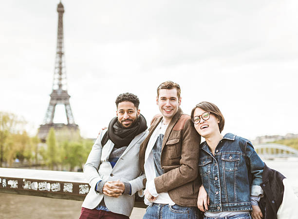 istock Multi-ethnic group of friends having fun in Paris along Seine 545113418