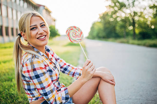 istock Beautiful lady with lollipop 545113866