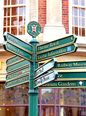 York, Yorkshire, UK. November 16, 2011.   A signpost giving directions to attractions and necessities in the center of the city of York.