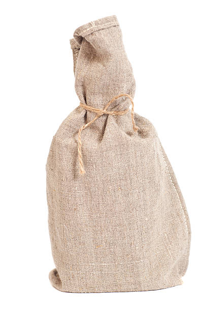 istock Tied with rope sack bag isolated on white 545115724