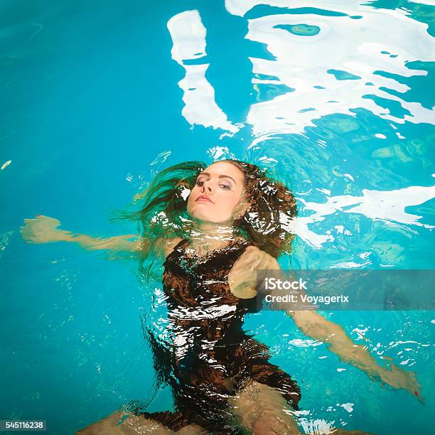 Woman Floating Relaxing In Swimming Pool Water Stock Photo - Download ...