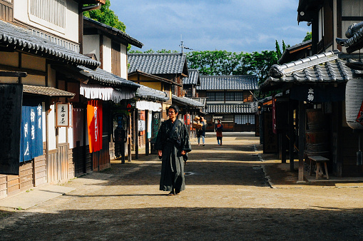 Portrait of samurai in traditional Japanese village, in sunny afternoon.Location: Kyoto, Japan