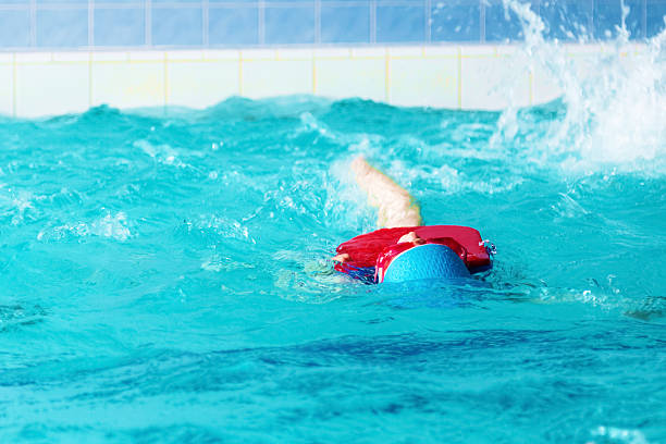 istock Children swimming in the pool 545118474