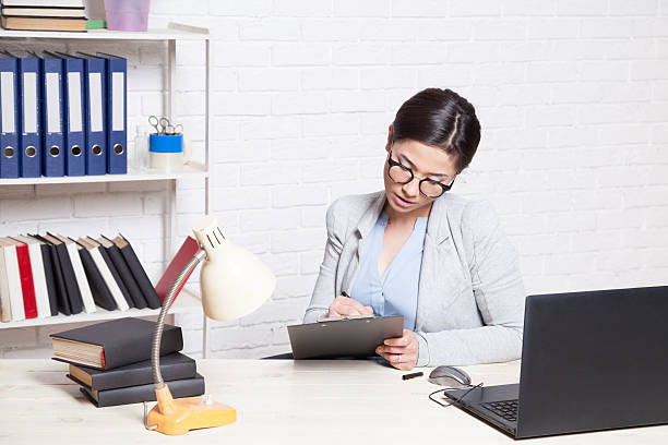 istock the girl works in an Office at a computer 545118998