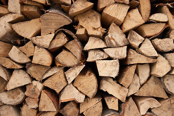istock Stacked chopped firewood as background 545119478