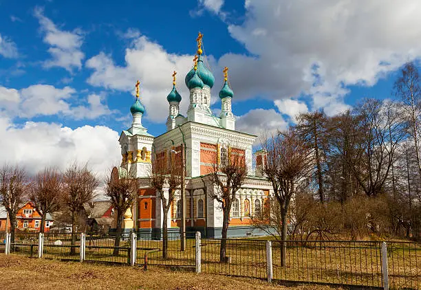 Marienburg, Russia - April 24, 2016: Stone building with five blue domes of bulbous form with crosses in the middle part of the tetrahedral. Church of the Intercession of the Mother of God in Marienburg. The current Orthodox Church. Construction of Protection Church led the academician of architecture IA Stefanits. Built in 1888. Location: Leningrad region, Gatchina district, Marienburg, ul.Krugovaya, 7.