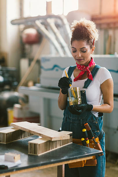 istock Latin Carpenter Painting Plank. 545121596