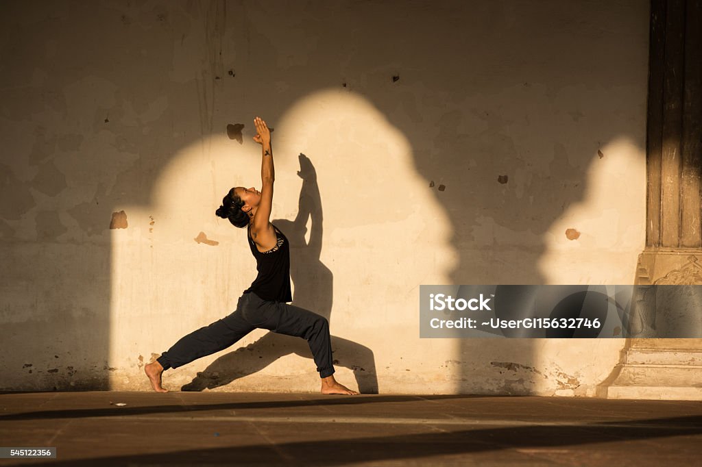 Woman practicing yoga in India. Woman practicing yoga in New Delhi, India. Yoga Stock Photo