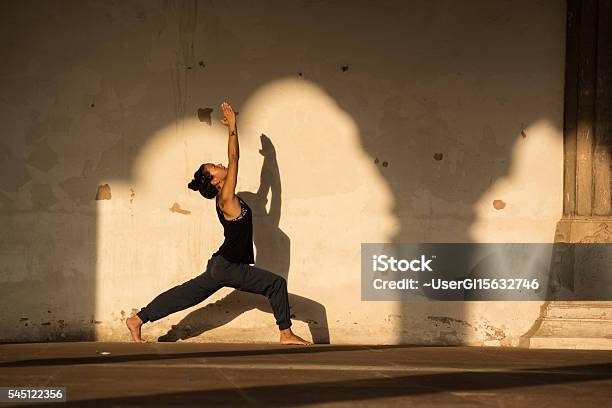 Woman Practicing Yoga In India Stock Photo - Download Image Now - Yoga, Sun Salutation, Women