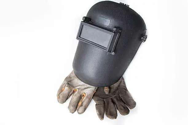 Welding mask and gloves on white background