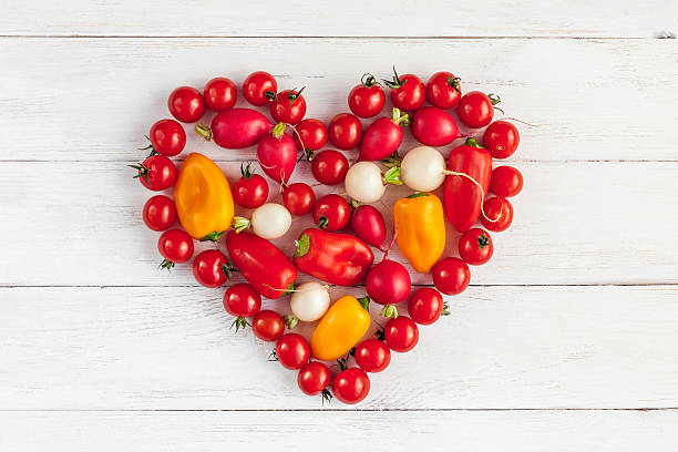 istock Fresh vegetables in a heart shape, top view, flat lay 545124638