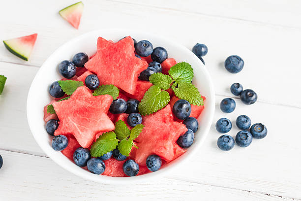 istock Summer fruit salad of watermelon and blueberries, top view 545126408